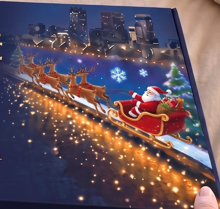 Twinkle Lane box art with Santa's sleigh over a glowing city